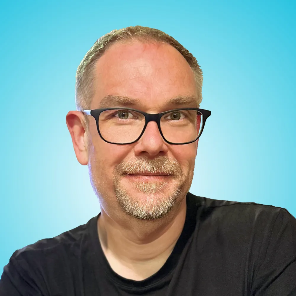 A photo of me with a blue background